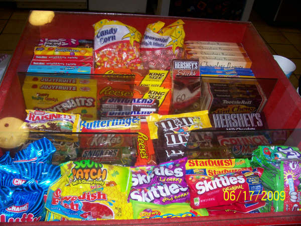 The candy case at the snack bar, stocked with movie-night favorites